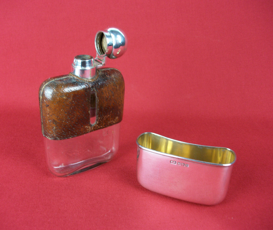 silver and leather bound hip flask